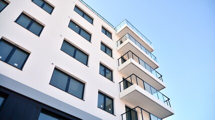 Condominium and apartment building with  symmetrical modern architecture in the city downtown.