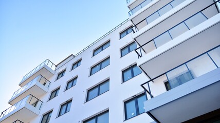 Condominium and apartment building with  symmetrical modern architecture in the city downtown.