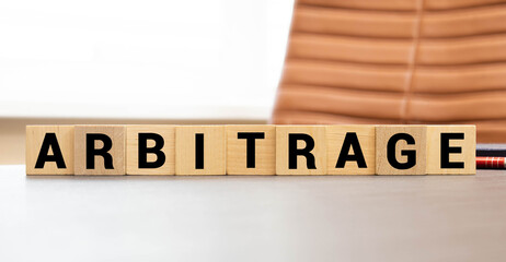 ARBITRAGE word made with building blocks