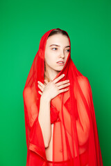 Sensual woman in red lingerie and cape