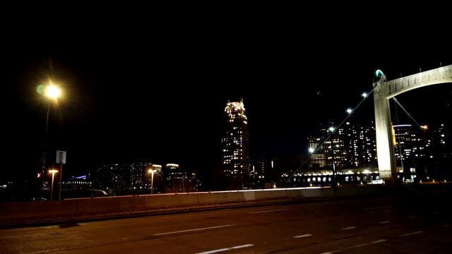 Minneapolis downtown at night, hennepin avenue bridge time lapse long exposure