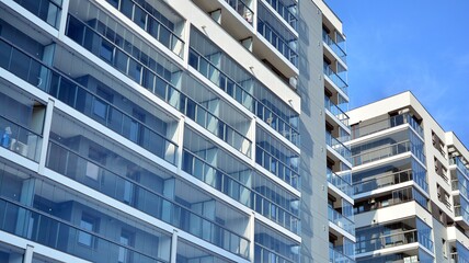 Condominium and apartment building with  symmetrical modern architecture in the city downtown.