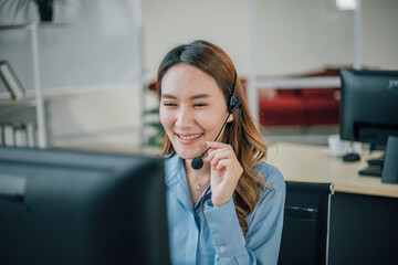 Female officer working and smiling in customer service office.