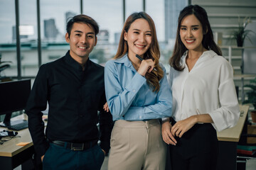 Portrait of asian business team smiling and looking at camera.