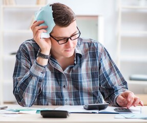 Young man frustrated at his house and tax bills