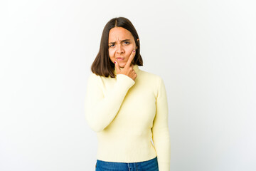 Young mixed race woman contemplating, planning a strategy, thinking about the way of a business.