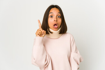 Young hispanic woman wearing a collar having some great idea, concept of creativity.