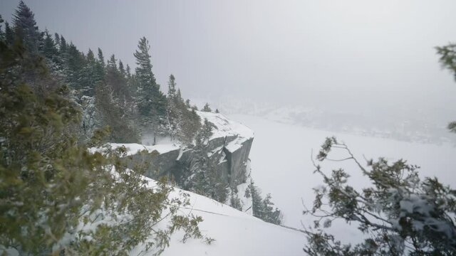 Mount Pinacle And Frozen Lake Lyster - Mountain Peak Of Covered In Snow During Snowstorm. wide shot