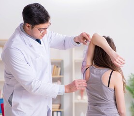 Doctor checking patients joint flexibility