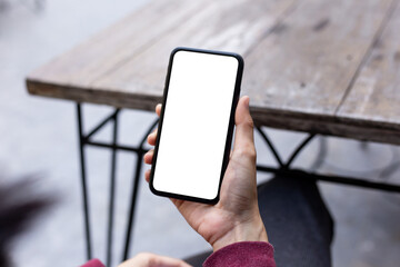 cell phone blank white screen mockup.woman hand holding texting using mobile on desk at office.background empty space for advertise.work people contact marketing business,technology