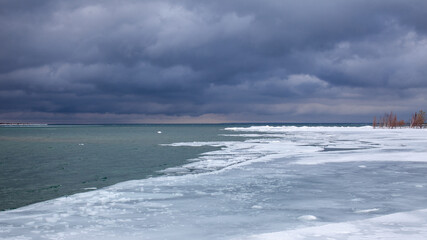 Winter storms help southern Georgian Bay to freeze over in the wintertime. Taken from a waterfront trail in Collingwood, Ontario