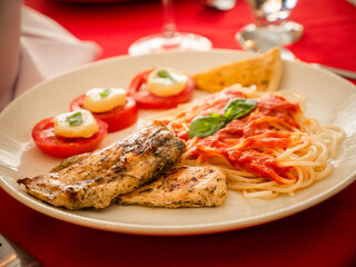 grilled steak with vegetables and pasta