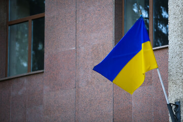 National flag of Ukraine on building wall outdoors