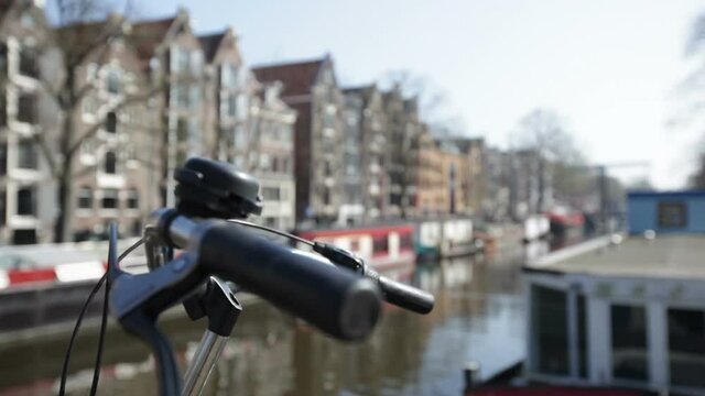 Amsterdam bicycle on canal rack focus
