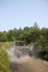 Sxs crusin through water on trails in VT © Click Stock 