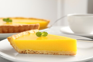 Slice of delicious homemade lemon pie on plate