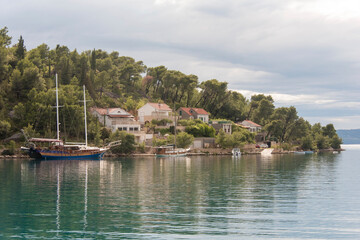 Fototapeta na wymiar Croatia, Brac, Bobovisca. Tour boats at anchor.