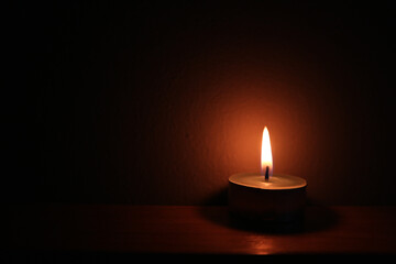 the candlelight in the dark room