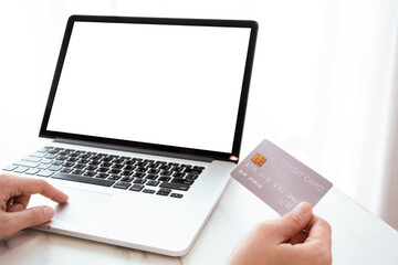 unrecognizable woman holding a credit card.