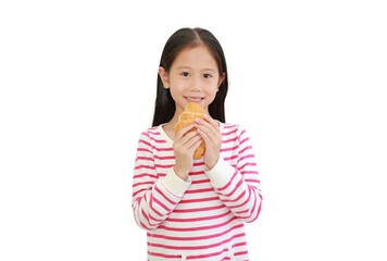 Portrait Asian little child girl eating croissant isolated on white background.