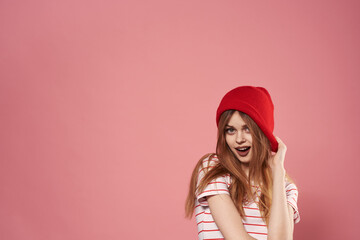 Cheerful pretty woman fashionable clothes studio fun pink background