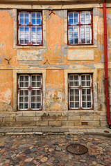 Baltic States, Estonia, Tallinn. Tallinn Old Town, city windows with peeling paint.