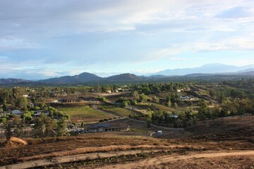 Aerial drone view of rural streets and roads in a residential area of a small town. Temecula, California, USA