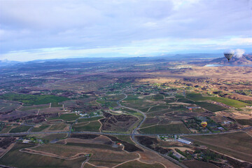 Colorful hot air balloon flying on blue sky background at Temecula in California. aerial view - 気球 カリフォルニア テメキュラ