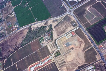 Fototapeta premium Aerial drone view of rural streets and roads in a residential area of a small town