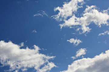 Deep blue sky and clouds in the light.