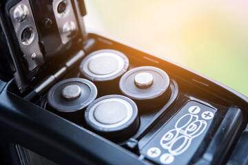 The concept of replacing batteries while traveling. AA batteries.