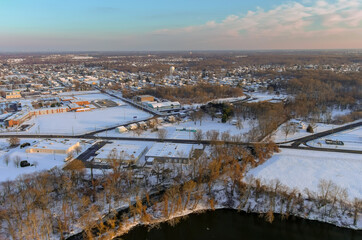 Residential houses areas in snowy covered neighborhood district City of Burlington, NJ with by the Delaware river with panorama of winter landscape