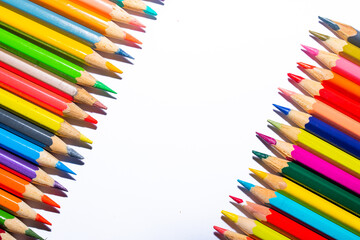 Two rows of colored pencils separated by white stripe
