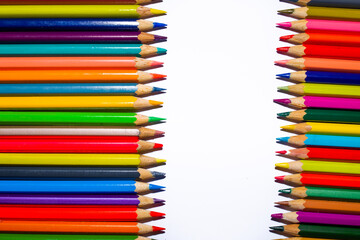 Two rows of colored pencils separated by white stripe