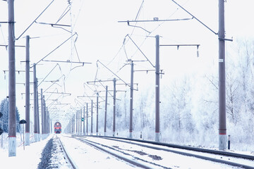 winter railway landscape, view of the rails and wires of the railway, winter delivery way