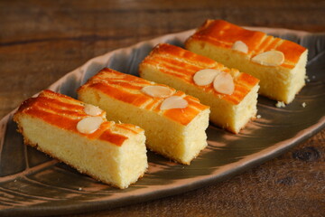 slice of Dutch style butter cake named boterkoek served in a plate  