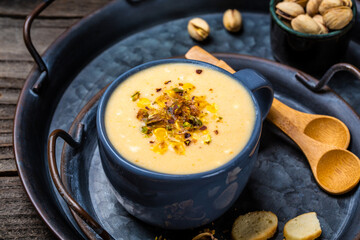 Creamy corn soup with roasted pistachios and croutons, Healthy food. Vegan cuisine. Restaurant menu, dieting, cookbook recipe