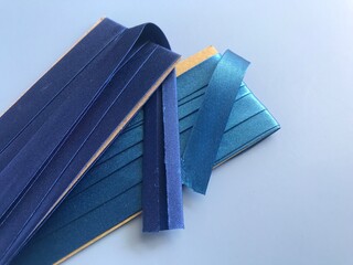 folded bias tapes on white background