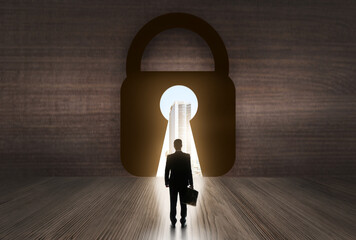 Small businessman looking at big city through key hole of padlock in box. Concept of choice