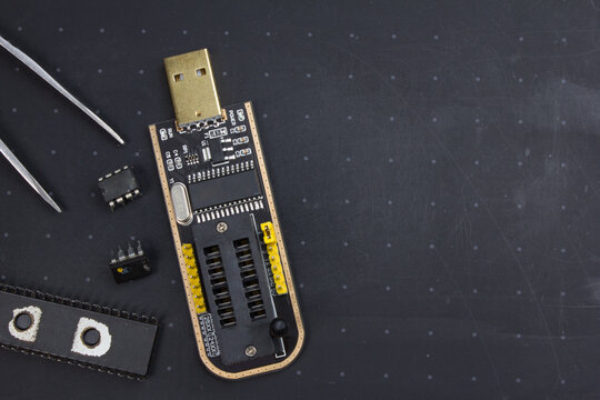 programmer with inserted microchip memory. radio electronics repair