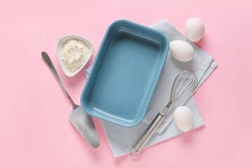Set of kitchen utensils and ingredients for preparing bakery on color background