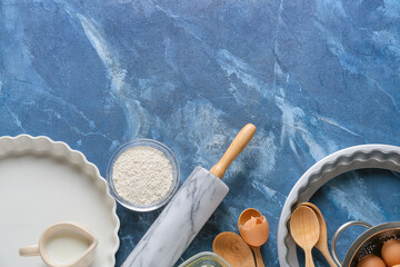 Set of kitchen utensils and ingredients for preparing bakery on color background