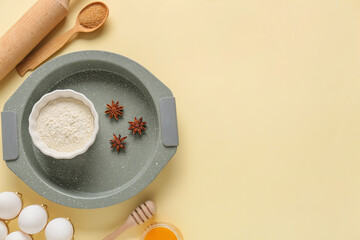 Set of kitchen utensils and ingredients for preparing bakery on color background