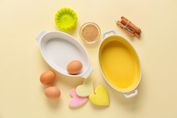 Kitchen utensils and ingredients for preparing bakery on color background