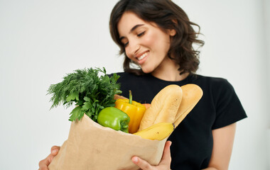 Woman with package of healthy food supermarket shopping