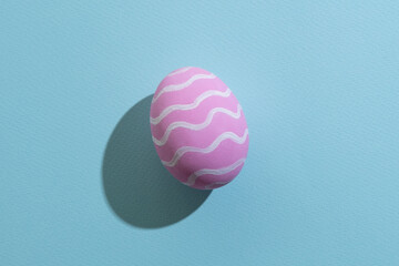 Easter egg. Festive decoration. Spring holiday card. Abstract background. Pink painted paschal...