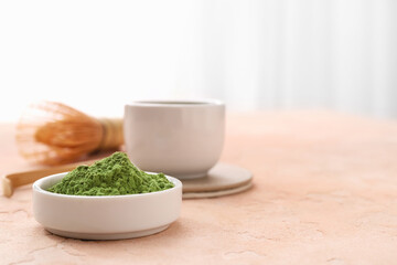 Bowl with powdered matcha tea on color background