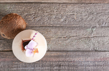 Fresh and ripe coconuts on wooden background