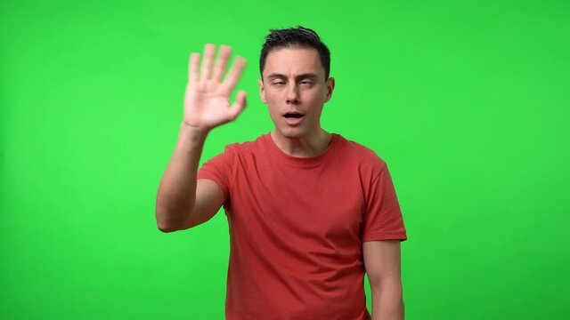 Cross-eyed man doing silly things. Chroma green background.