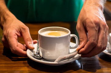person holding a cup of coffee